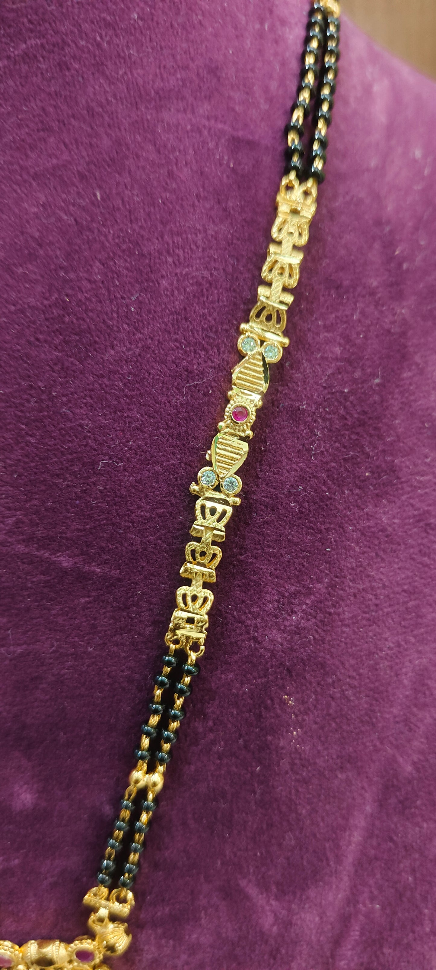 100% gold look 22" length 2 line black beads