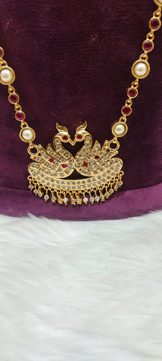 Pure panchaloham double swam pendent long haram with ruby stones