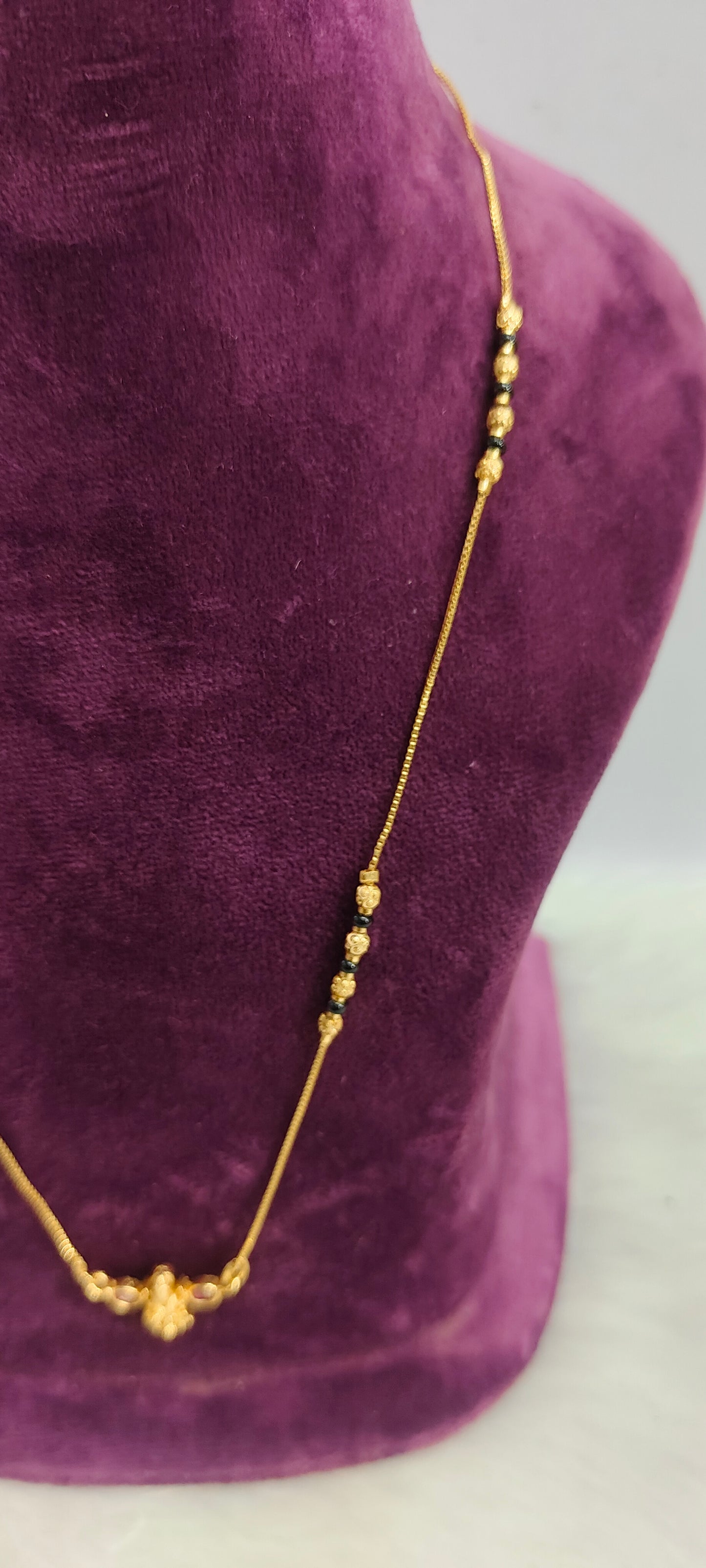 Gold look invisible 18" length black beads
