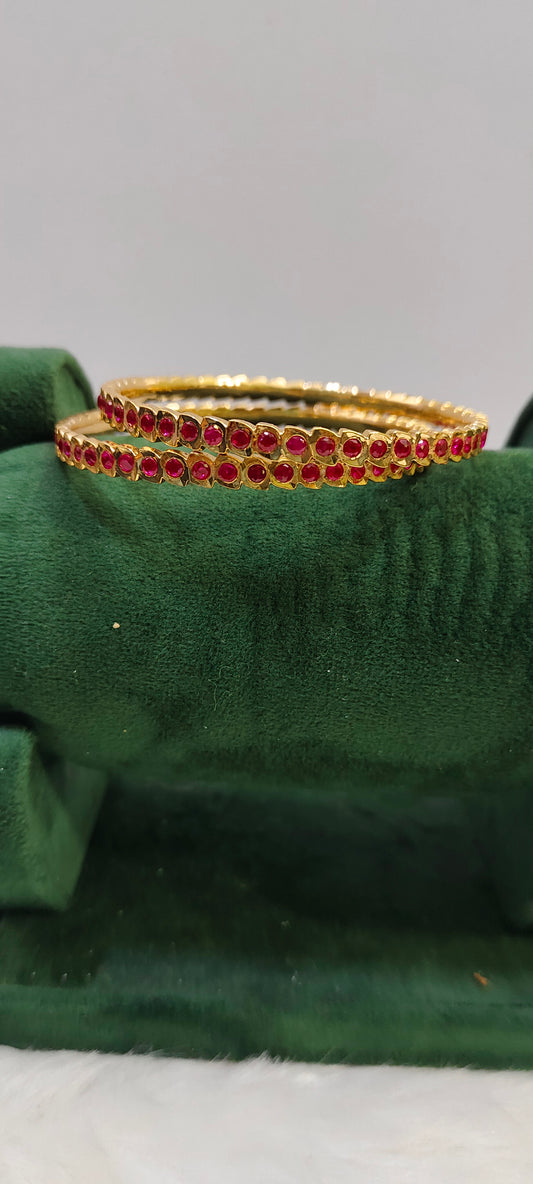 Pure panchaloham ruby bangles with closed setting
