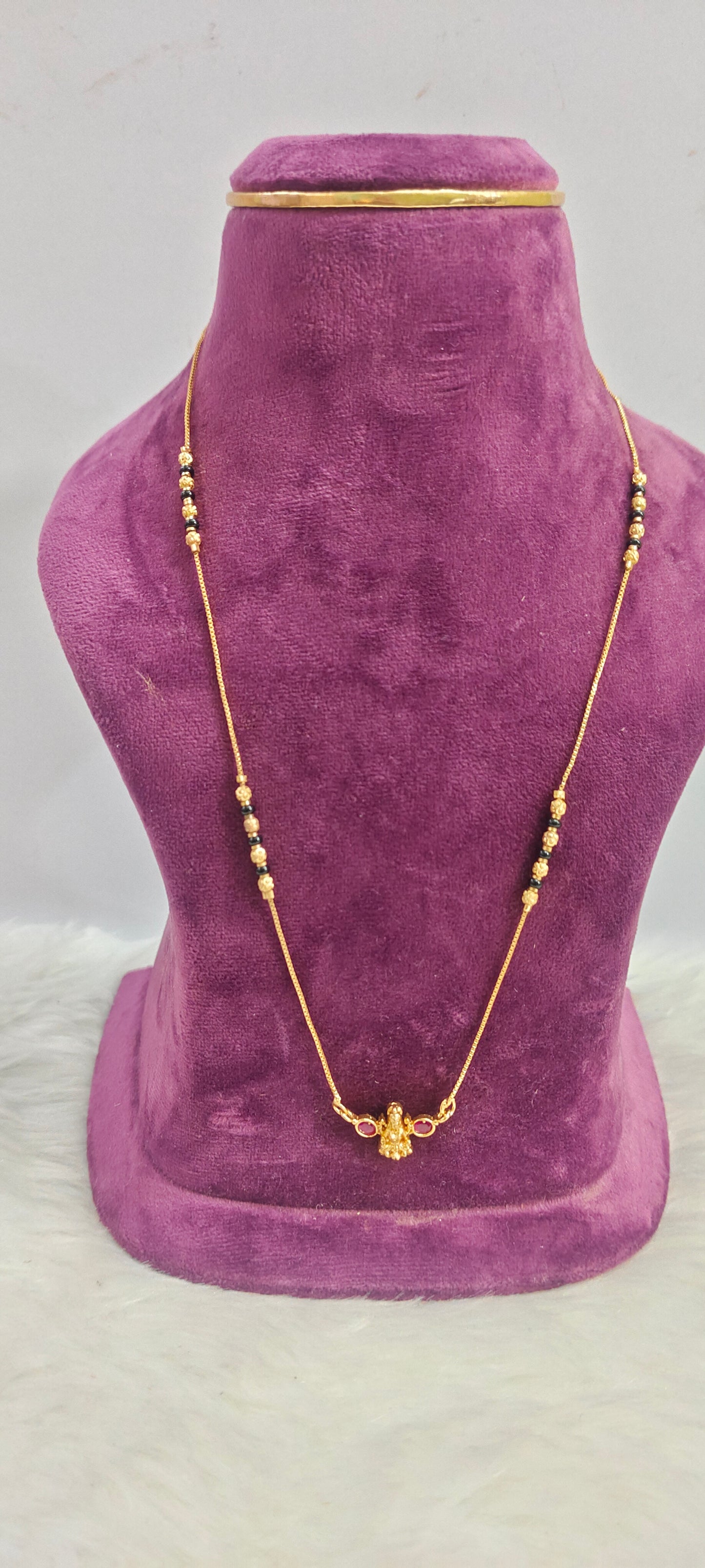 Gold look invisible 18" length black beads