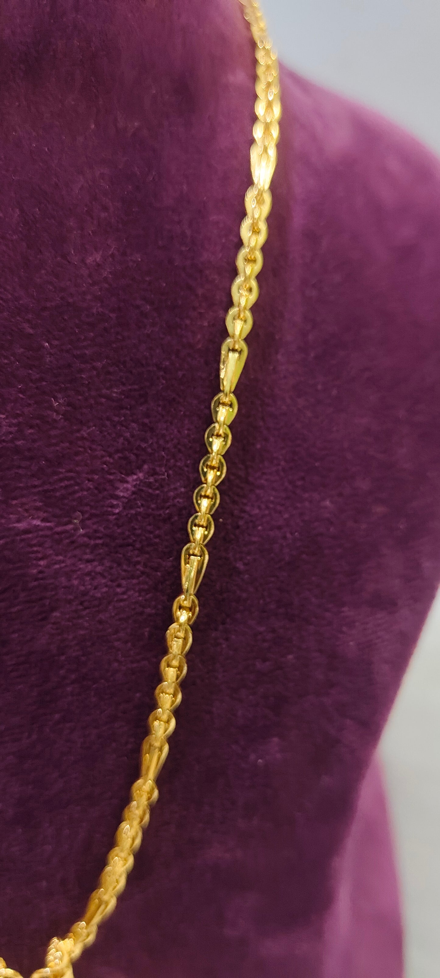 Same as gold om pendant with 20" length chain