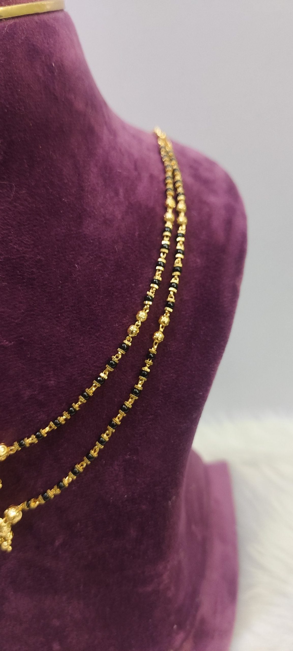 1gram plated 2 line black beads
