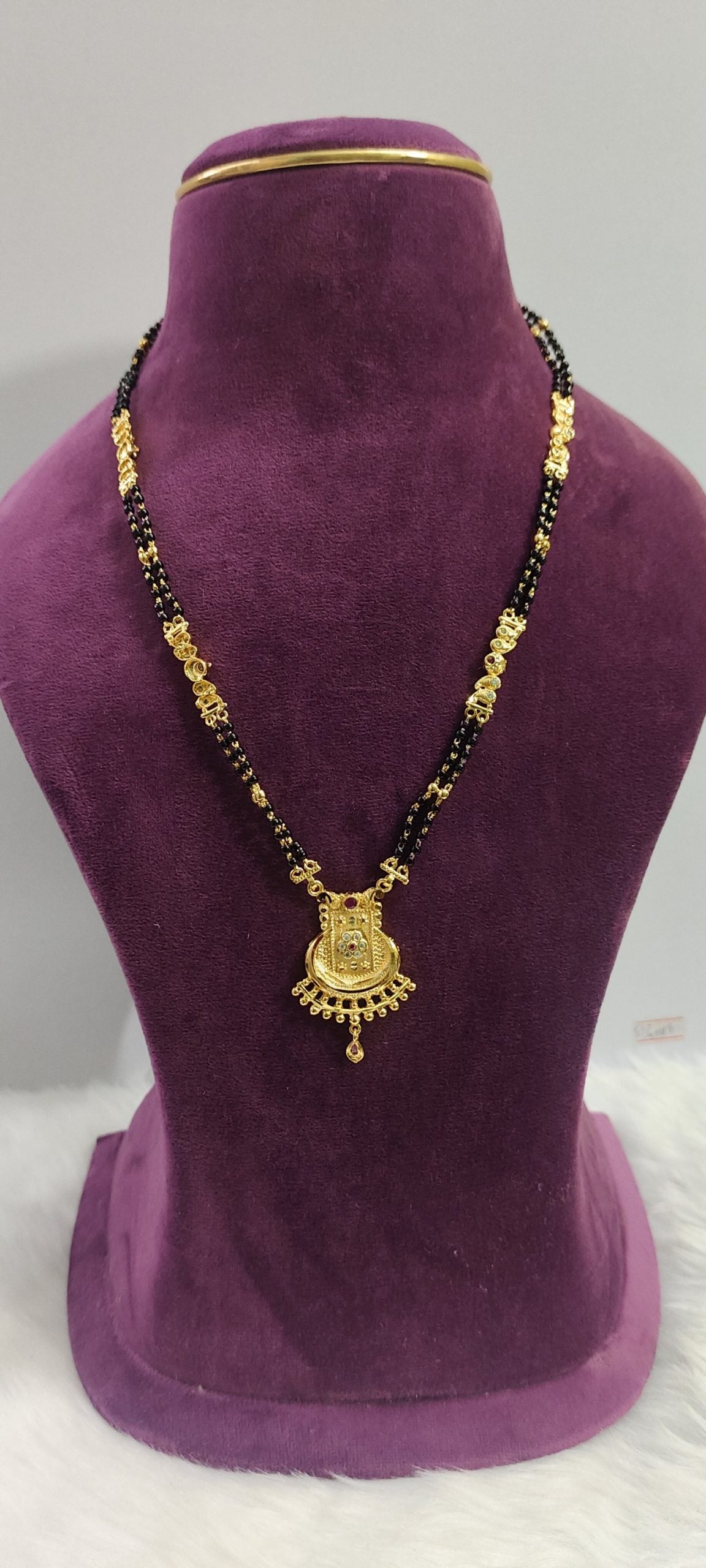 100% gold look black beads