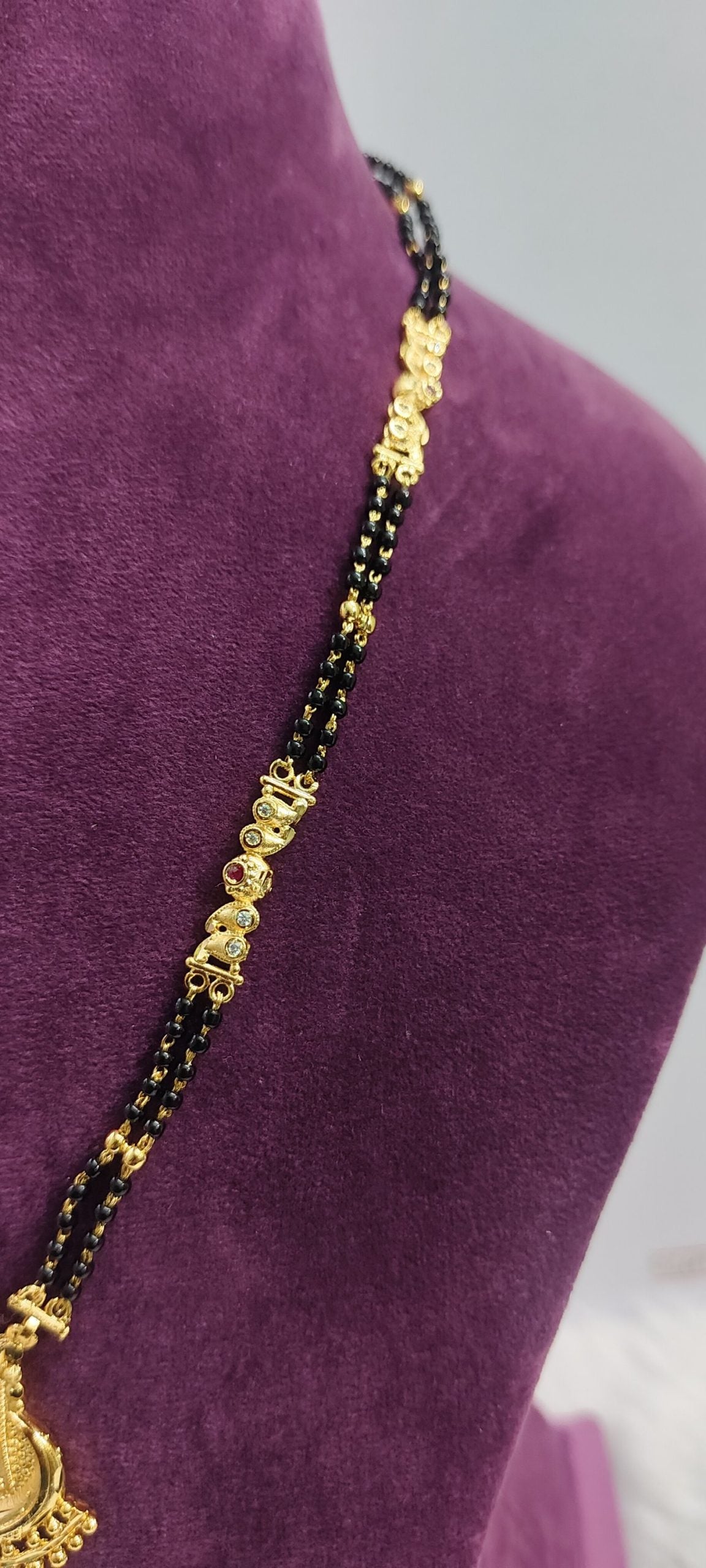 100% gold look black beads