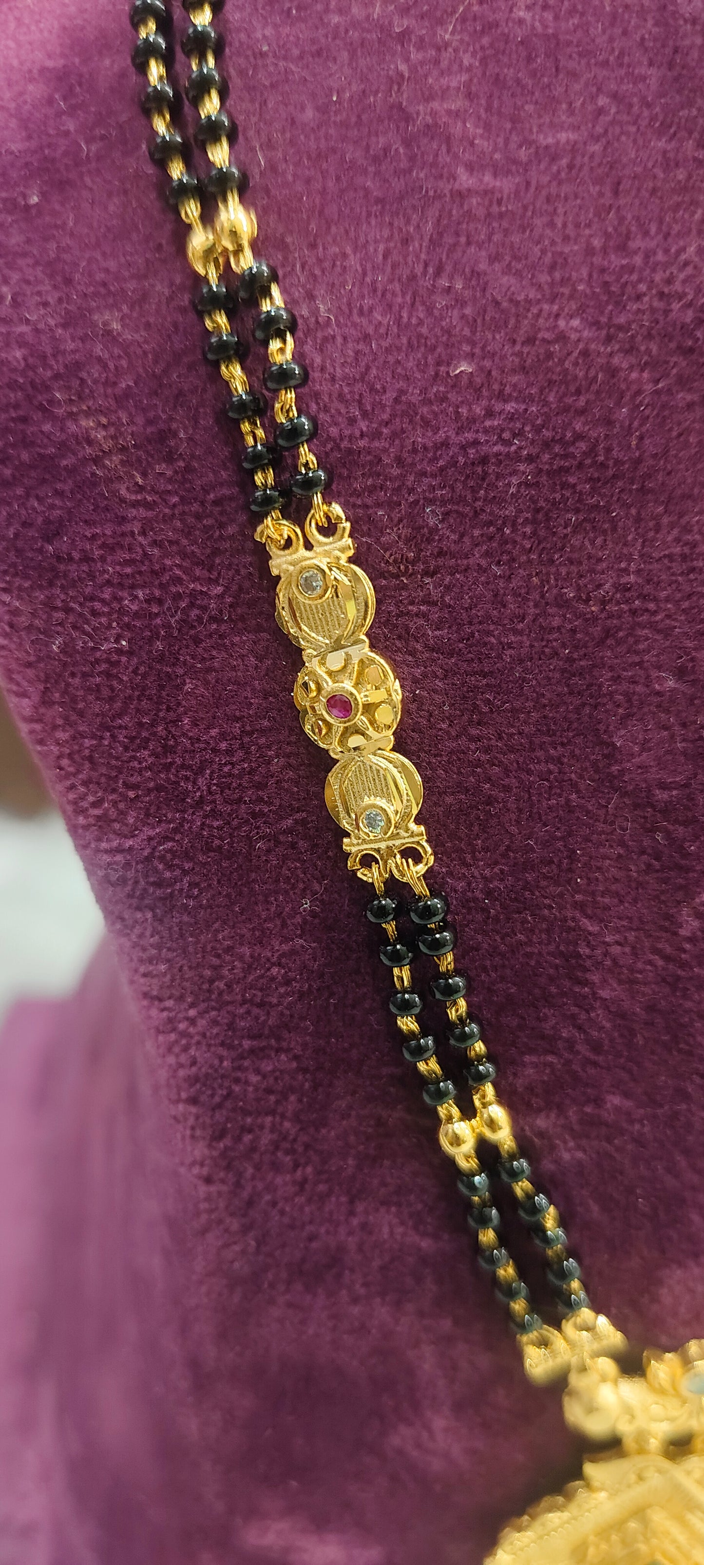 100% gold look 22" length 2 line black beads