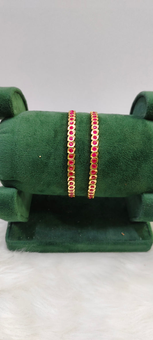 Pure panchaloham ruby bangles with closed setting