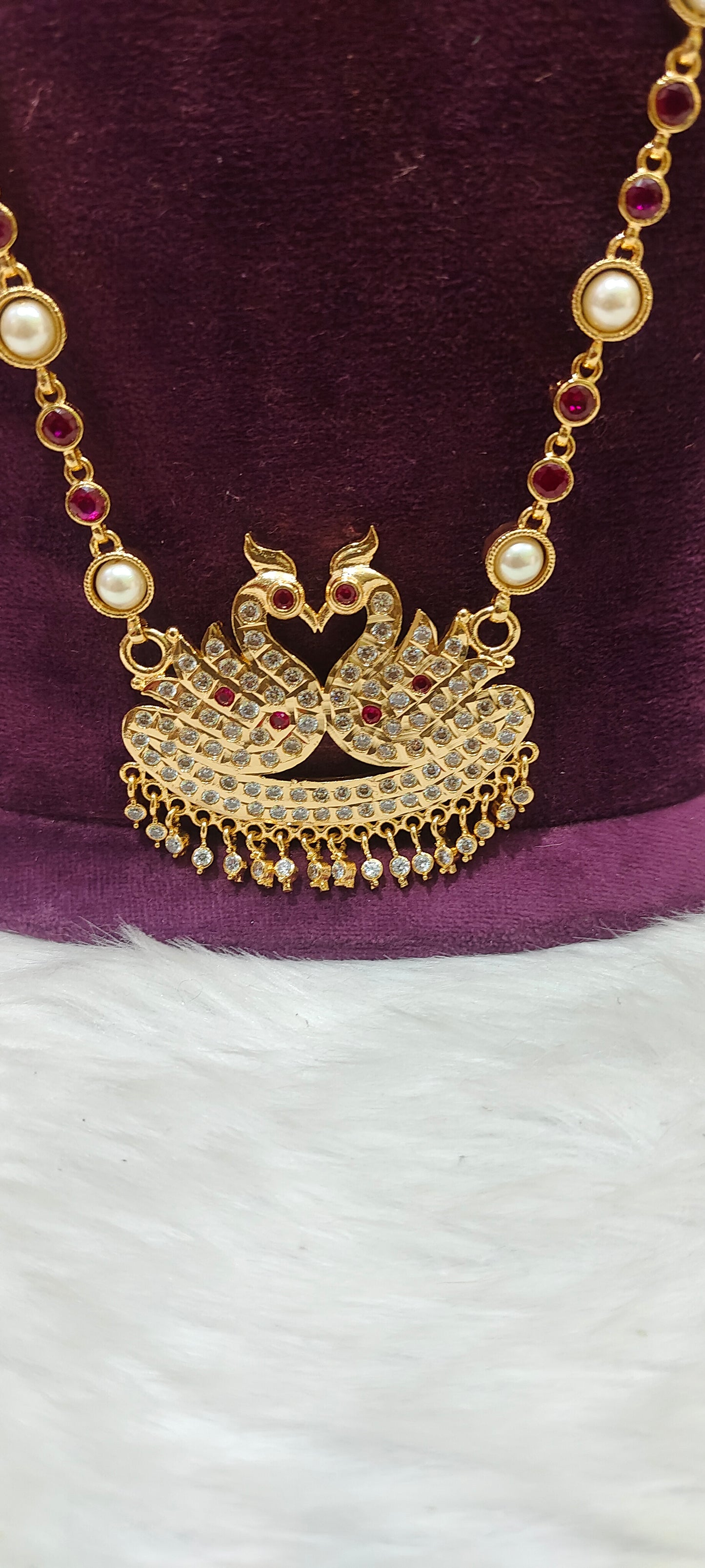 Pure panchaloham double swam pendent long haram with ruby stones