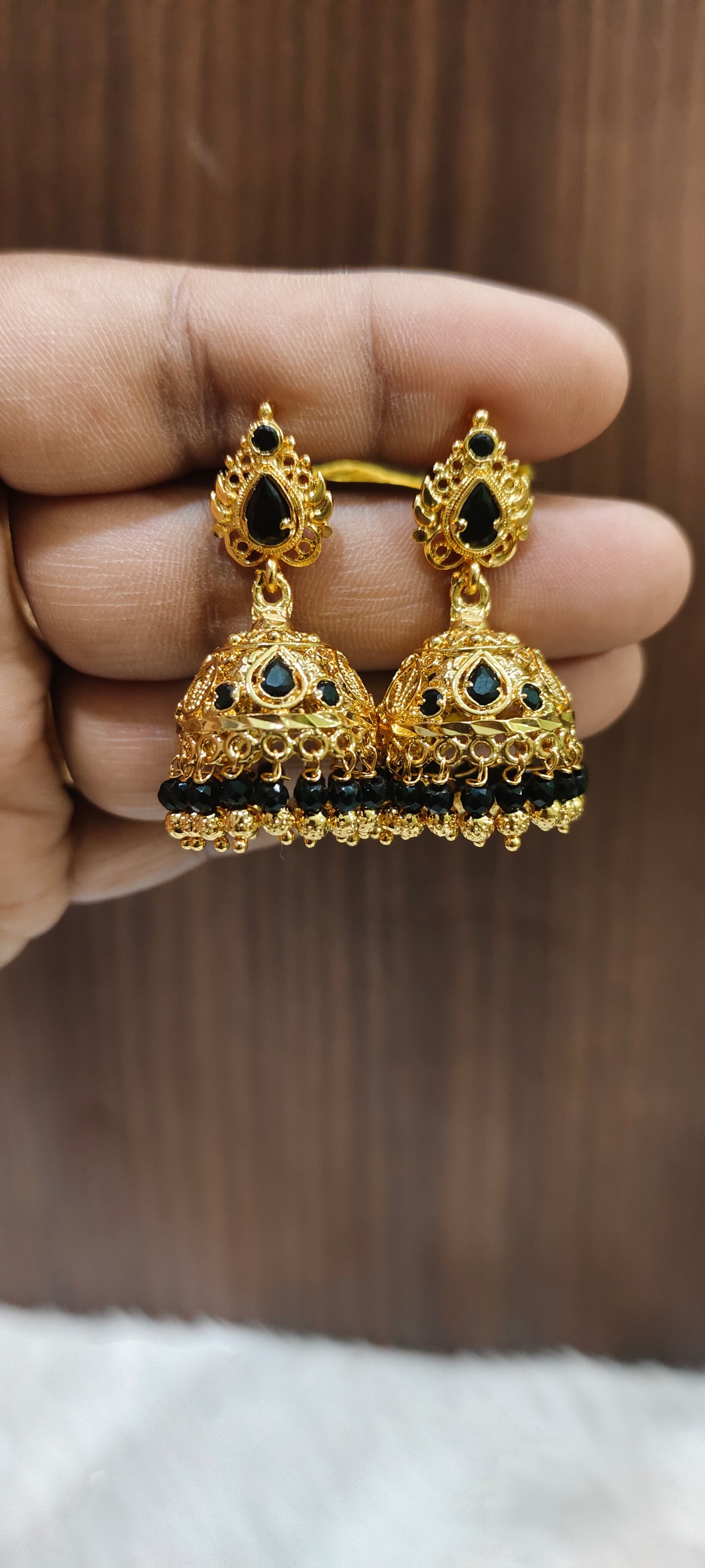 Beautiful gold look black beads jumkas with screw back
