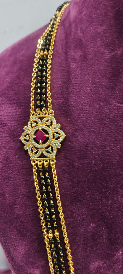Premium micro gold plated 26" length black beads and with side brouch