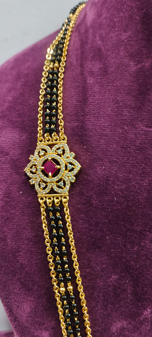 Premium micro gold plated 26" length black beads and with side brouch