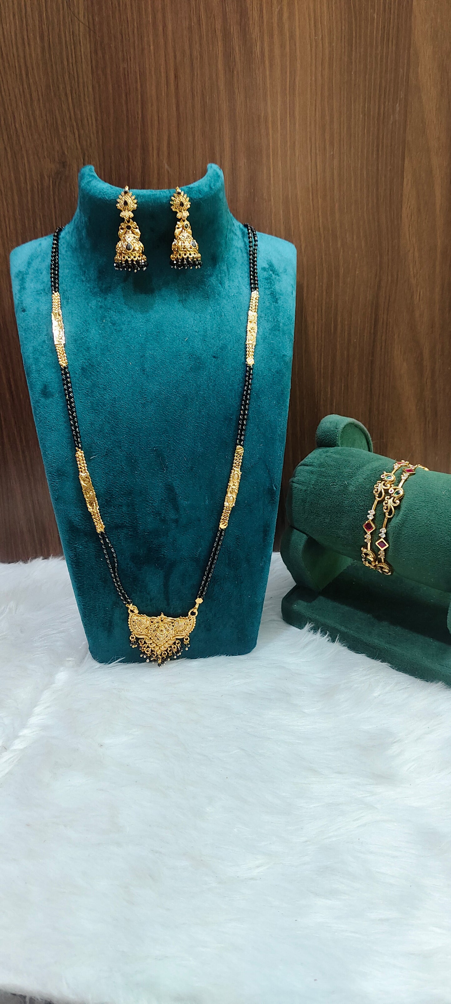 Premium gold look 3 set combo( black beads 28" length,jumkas, bangles)