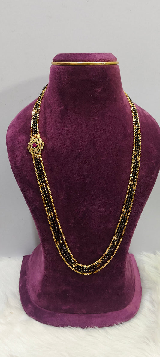 Premium micro gold plated 26" length black beads and with side brouch