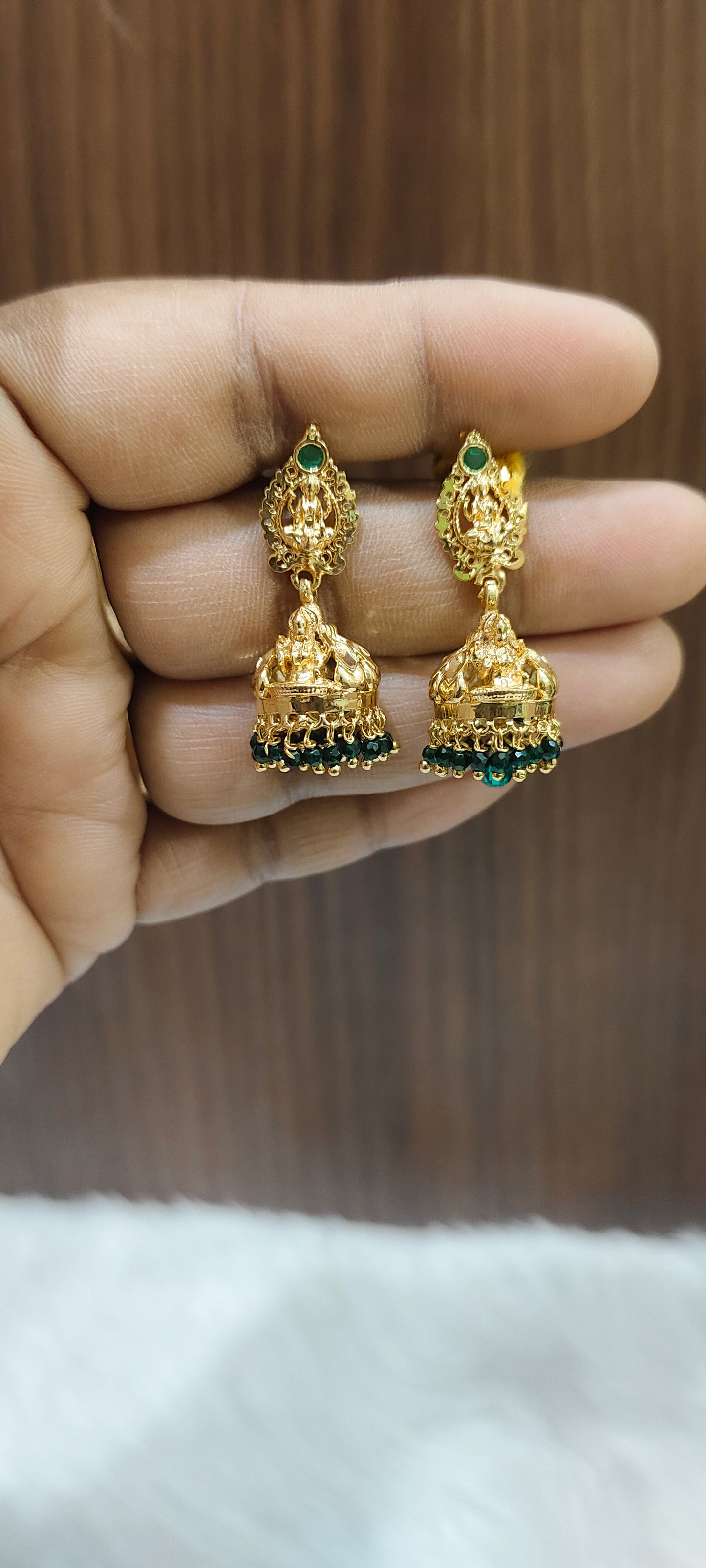 Premium micro gold plated Lakshmi Devi jumkas with green beads and screw back