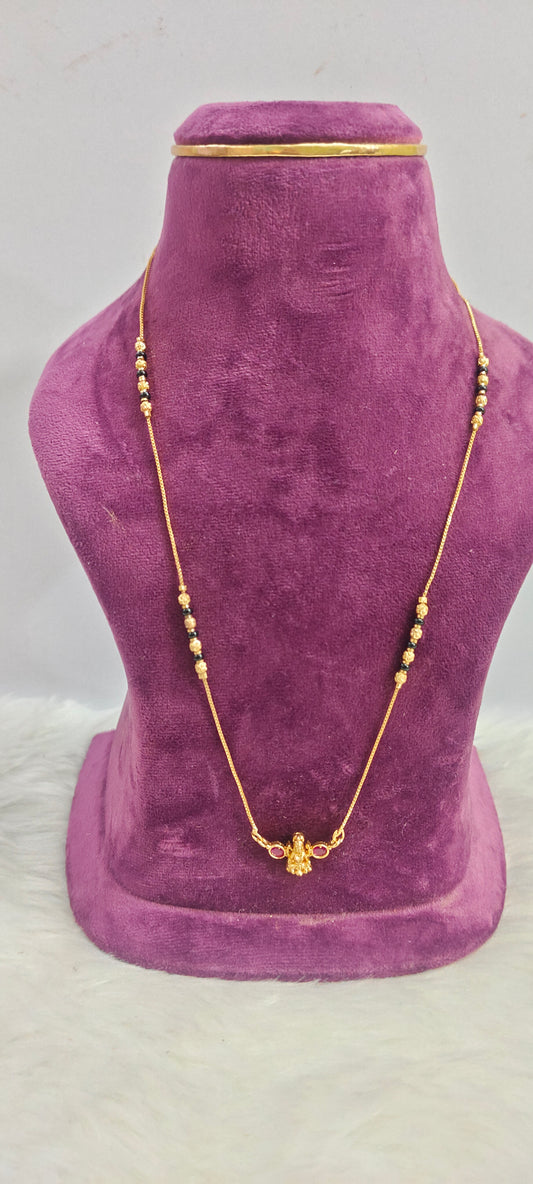 Gold look invisible 18" length black beads