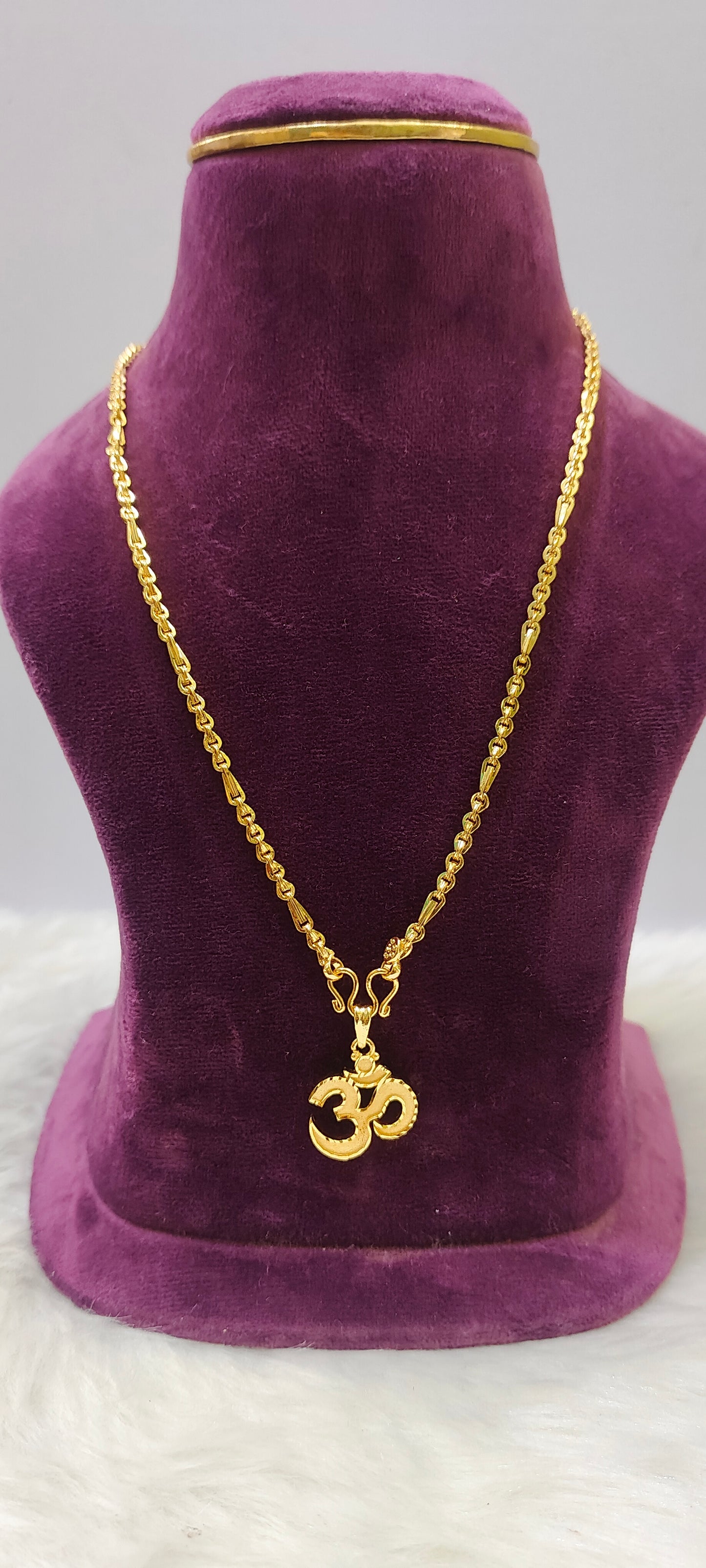 Same as gold om pendant with 20" length chain