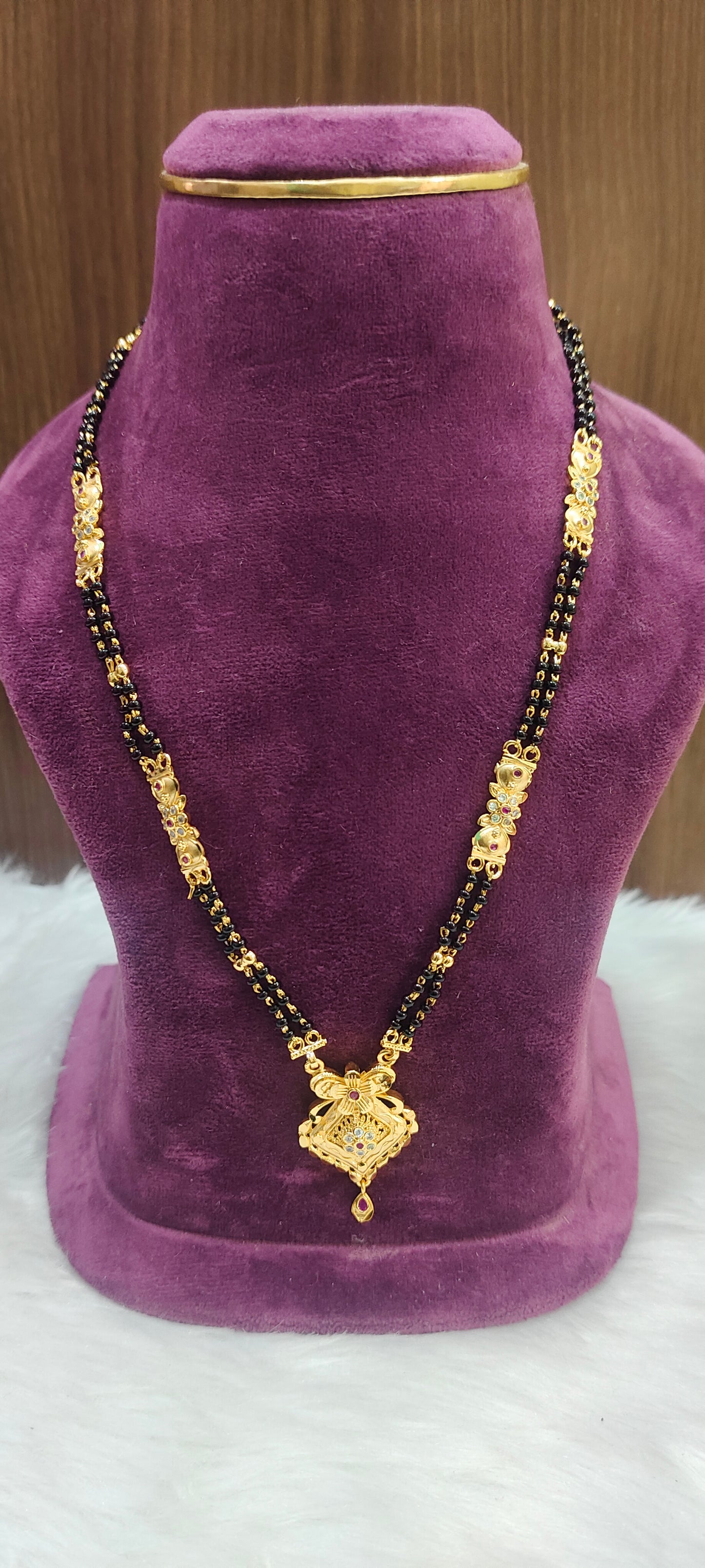100% gold look 22" length 2 line black beads